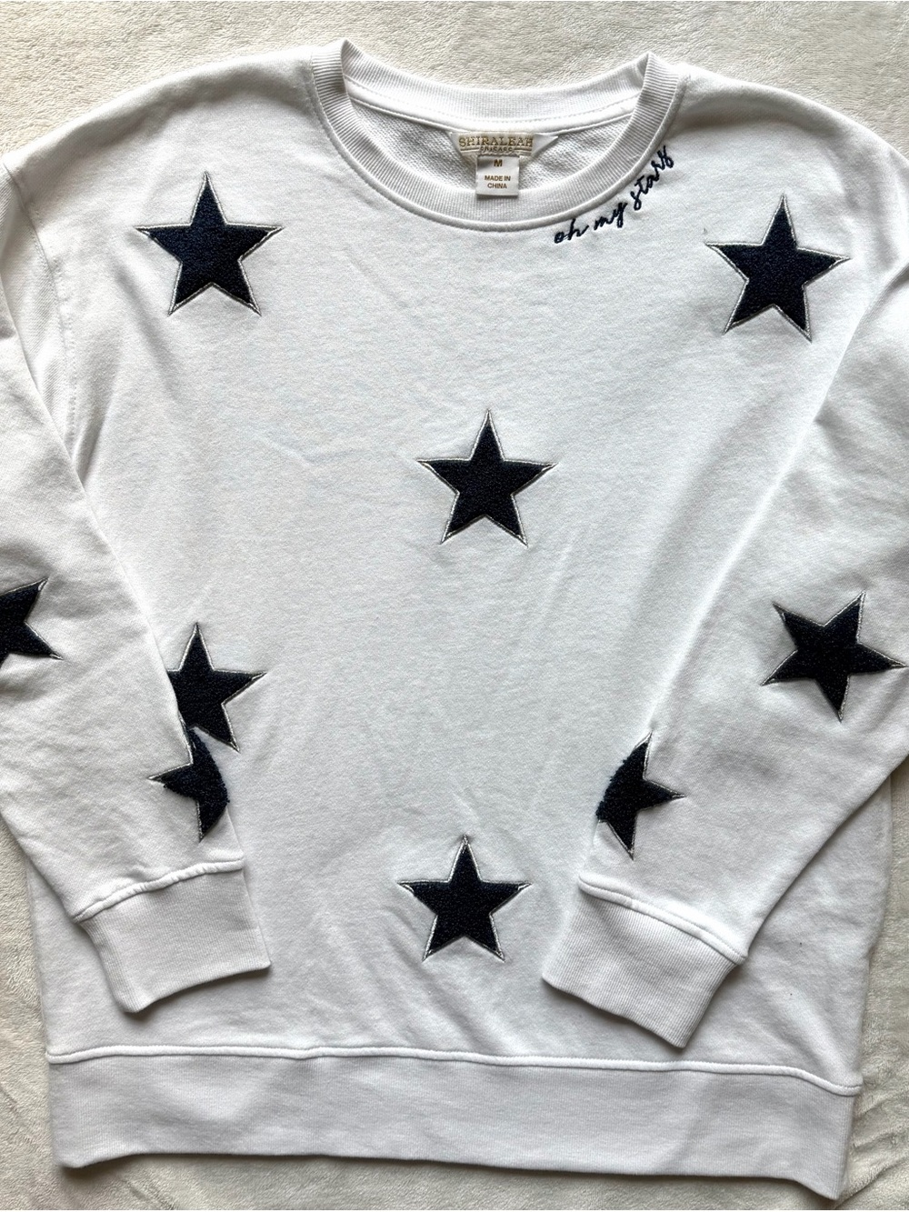 Shiraleah White Sweatshirt with Navy/Silver Metallic Star Appliqués
